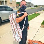 Photo of DCSO Corporal Brian Briggs carries a sleeping mat