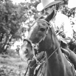 Photo of Dennis Niewoehner on his beloved horse, Wrangle