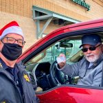 Photo of Sheriff Spurlock hit the drive-thru line donning his Santa hat at Ziggi's