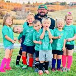 Photo of Volunteer coach Donny McCleery gets silly with the soccer tots.