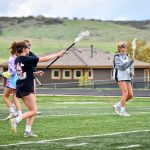 Photo of Rock Canyon High School girls lacrosse team playing.