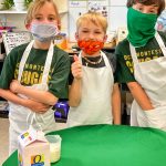 Photo of classmates work together to make the perfect batch of pão de queijo