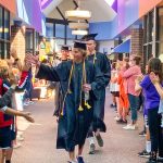 Photo of former Buffalo Ridge students give high-fives upon return to BRE.