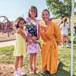 Photo of fourth grader Elise Avetisy, her sister Margot (left) and TTE music teacher Madison Armstrong.