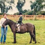 Photo of Erica Aizenman as a child on her horse farm in New Jersey.