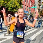 Photo of Stacia Wilkins who is all smiles at the New York City Marathon.