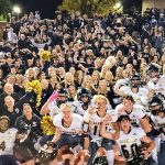 Photo of Rock Canyon High School football team and school fans.