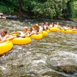 Photo of Rock Canyon High School varsity soccer team tubing at Clear Creek