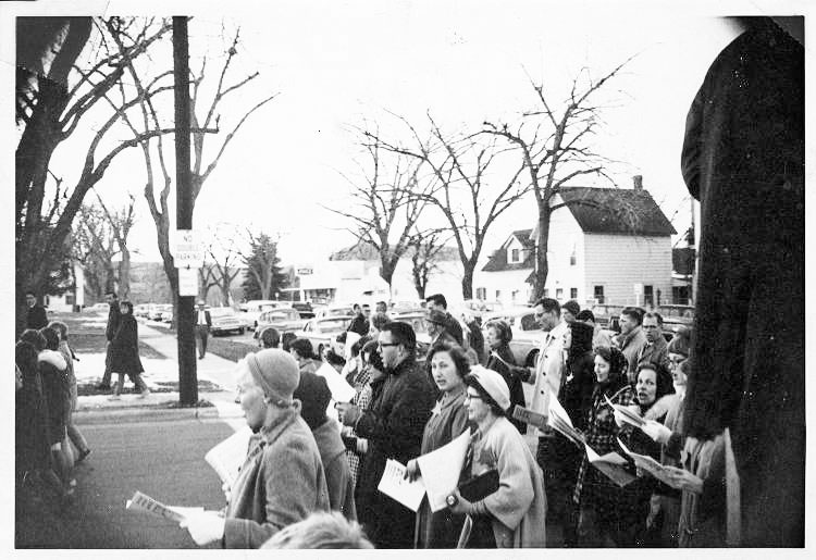 old photo of people gathered in town street